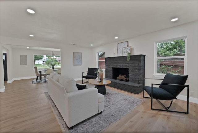 1146 Norwood Dr, Hurst, TX 76053 - living room featuring baseboards, light wood-style flooring, recessed lighting, and a fireplace