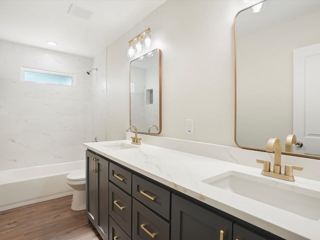 317 Clarence St Unit B, Fort Worth, TX 76111 - full bath with toilet, double vanity, wood finished floors, and bathing tub / shower combination