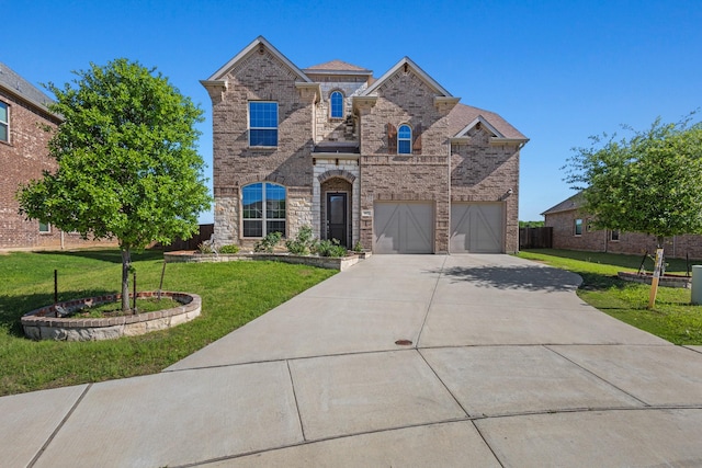 417 Burberry, Grand Prairie, TX 75052 - view of front of house with an attached garage, driveway, a front yard, and brick siding