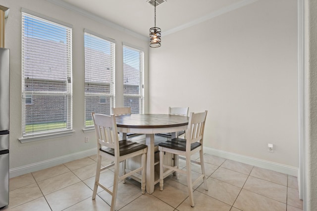 417 Burberry, Grand Prairie, TX 75052 - dining space with ornamental molding, healthy amount of natural light, baseboards, and light tile patterned flooring