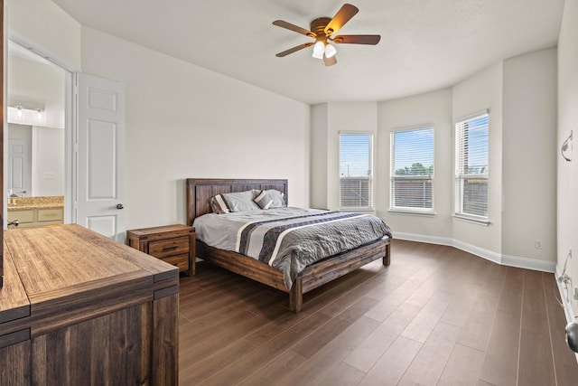 417 Burberry, Grand Prairie, TX 75052 - bedroom featuring dark wood-style floors, baseboards, a ceiling fan, and ensuite bath