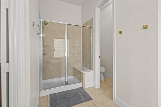 417 Burberry, Grand Prairie, TX 75052 - bathroom featuring tile patterned flooring, a stall shower, toilet, and baseboards