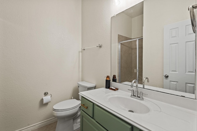417 Burberry, Grand Prairie, TX 75052 - bathroom featuring a stall shower, toilet, vanity, a textured wall, and baseboards