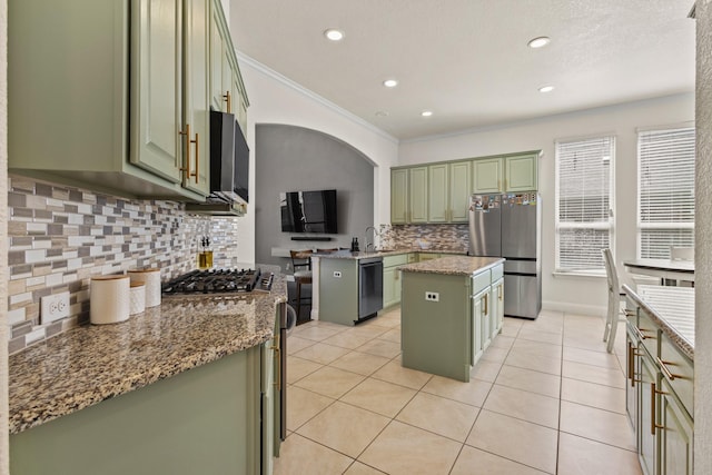 417 Burberry, Grand Prairie, TX 75052 - kitchen with green cabinets, stainless steel appliances, decorative backsplash, crown molding, and recessed lighting