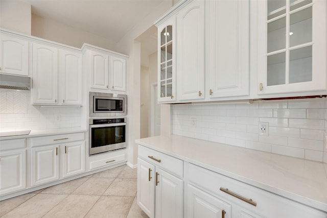1527 Pleasant Run, Allen, TX 75002 - kitchen featuring appliances with stainless steel finishes, light countertops, white cabinets, and light tile patterned floors