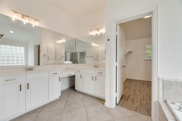 1527 Pleasant Run, Allen, TX 75002 - full bath with tile patterned floors, vanity, and a relaxing tiled tub