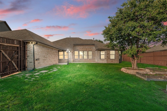 1527 Pleasant Run, Allen, TX 75002 - rear view of house featuring brick siding, a gate, and roof with shingles