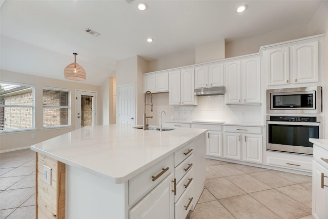 1527 Pleasant Run, Allen, TX 75002 - kitchen featuring stainless steel appliances, light tile patterned floors, under cabinet range hood, a sink, and tasteful backsplash