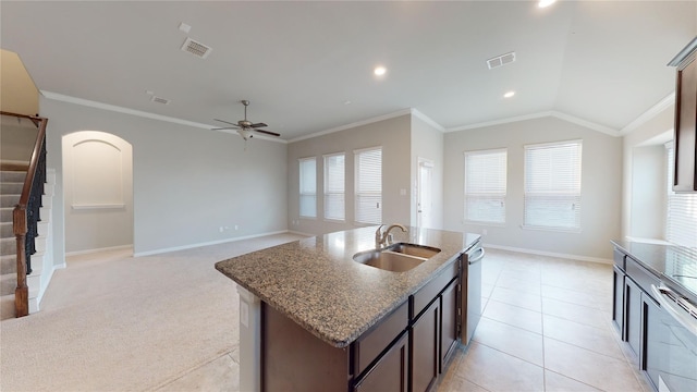 304 Eden Dr, Fate, TX 75189 - kitchen with a sink, ornamental molding, ceiling fan, stone counters, and baseboards