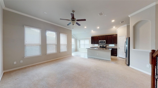 304 Eden Dr, Fate, TX 75189 - kitchen featuring appliances with stainless steel finishes, open floor plan, ceiling fan, light carpet, and crown molding