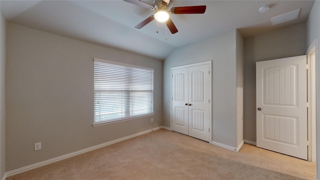 304 Eden Dr, Fate, TX 75189 - unfurnished bedroom featuring light carpet, a closet, baseboards, vaulted ceiling, and ceiling fan