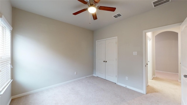 304 Eden Dr, Fate, TX 75189 - unfurnished bedroom featuring light carpet, a closet, baseboards, and a ceiling fan