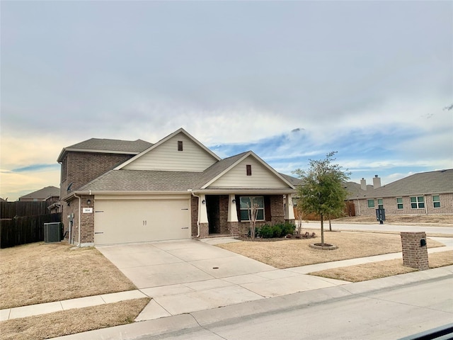 304 Eden Dr, Fate, TX 75189 - view of front of property with brick siding, concrete driveway, a garage, cooling unit, and fence