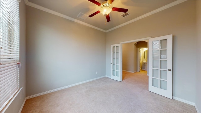 304 Eden Dr, Fate, TX 75189 - spare room featuring french doors, light carpet, ornamental molding, baseboards, and a ceiling fan