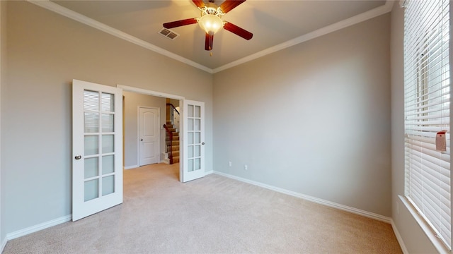 304 Eden Dr, Fate, TX 75189 - empty room featuring french doors, light carpet, baseboards, crown molding, and ceiling fan