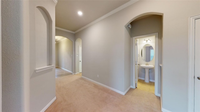 304 Eden Dr, Fate, TX 75189 - hall with arched walkways, light carpet, crown molding, baseboards, and recessed lighting