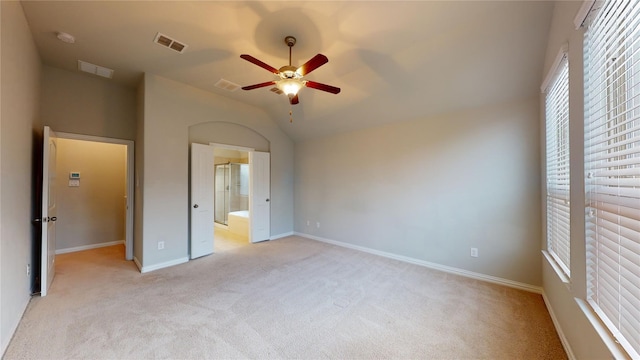 304 Eden Dr, Fate, TX 75189 - unfurnished bedroom with light carpet, baseboards, ensuite bathroom, lofted ceiling, and a ceiling fan