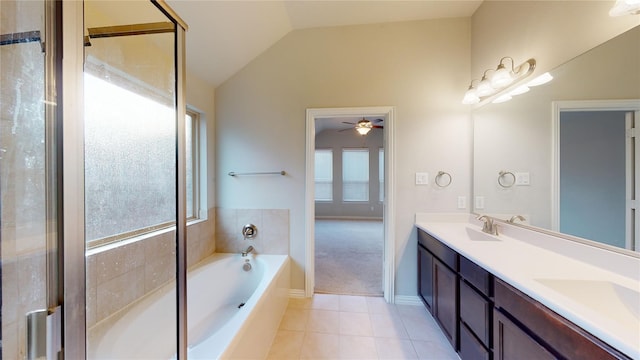 304 Eden Dr, Fate, TX 75189 - full bathroom with plenty of natural light, tile patterned floors, lofted ceiling, a garden tub, and double vanity