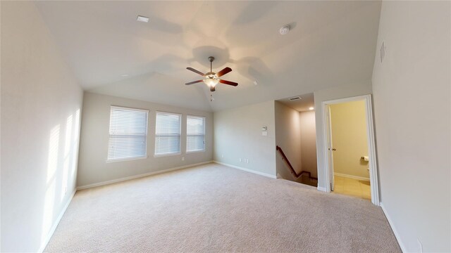 304 Eden Dr, Fate, TX 75189 - unfurnished room featuring light colored carpet, ceiling fan, vaulted ceiling, and baseboards
