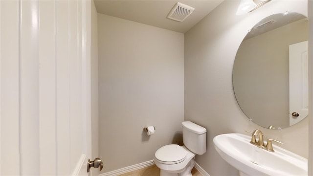 304 Eden Dr, Fate, TX 75189 - bathroom with a sink, toilet, and baseboards