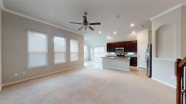 304 Eden Dr, Fate, TX 75189 - kitchen featuring stainless steel appliances, open floor plan, ceiling fan, light carpet, and ornamental molding