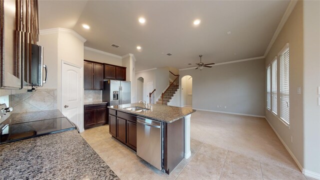 304 Eden Dr, Fate, TX 75189 - kitchen featuring arched walkways, a sink, stainless steel appliances, crown molding, and recessed lighting