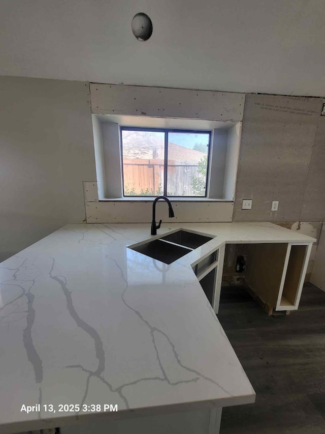 202 Sunset Dr, Glenn Heights, TX 75154 - kitchen with a sink, light stone countertops, and dark wood-type flooring