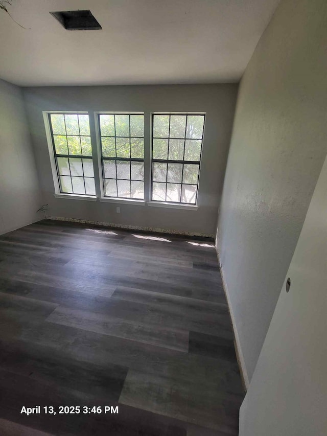 202 Sunset Dr, Glenn Heights, TX 75154 - empty room featuring dark wood-style flooring and baseboards
