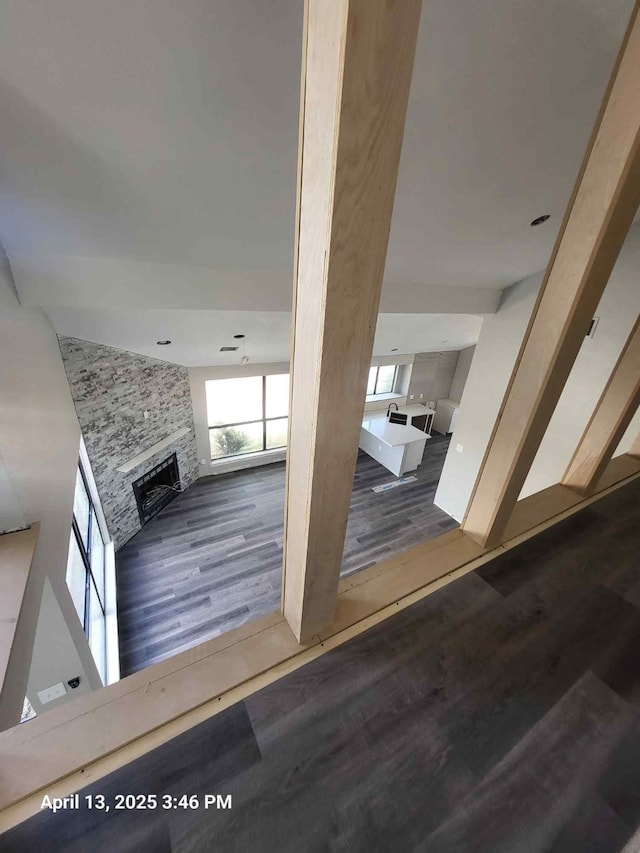 202 Sunset Dr, Glenn Heights, TX 75154 - stairway featuring a large fireplace and wood finished floors
