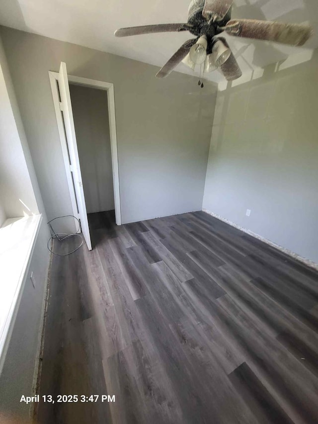 202 Sunset Dr, Glenn Heights, TX 75154 - unfurnished bedroom featuring wood finished floors and a ceiling fan