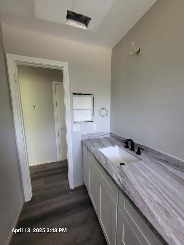 202 Sunset Dr, Glenn Heights, TX 75154 - bathroom with vanity and wood finished floors