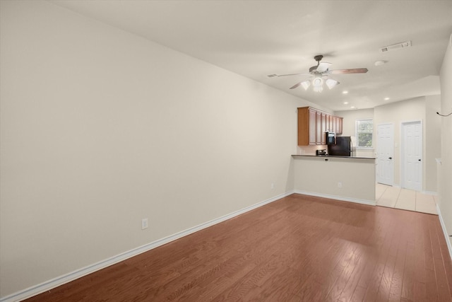 908 Glenn Crossett St, Arlington, TX 76010 - unfurnished living room featuring light wood-type flooring, recessed lighting, baseboards, and a ceiling fan