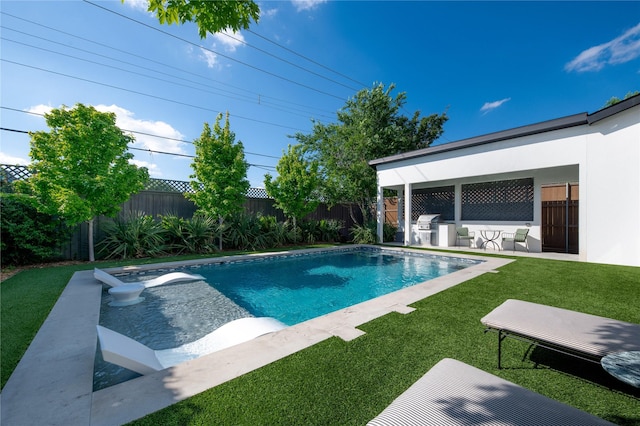 view of pool featuring grilling area, area for grilling, and a patio