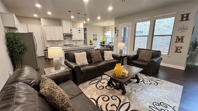4557 El Paso Dr, Plano, TX 75024 - living room with dark wood-type flooring, recessed lighting, and baseboards