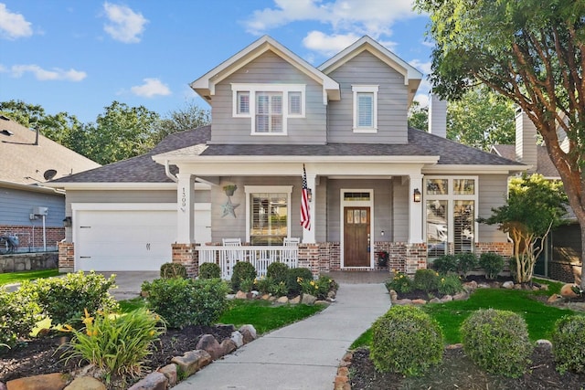 1309 Constitution Dr, Mckinney, TX 75071 - view of front facade with covered porch, brick siding, a garage, and roof with shingles
