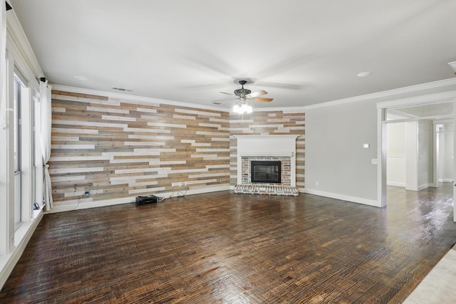 1309 Constitution Dr, Mckinney, TX 75071 - unfurnished living room featuring a ceiling fan, a fireplace, wood finished floors, crown molding, and baseboards
