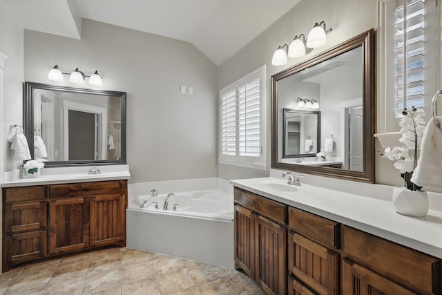 1309 Constitution Dr, Mckinney, TX 75071 - bathroom featuring vaulted ceiling, a bath, and two vanities