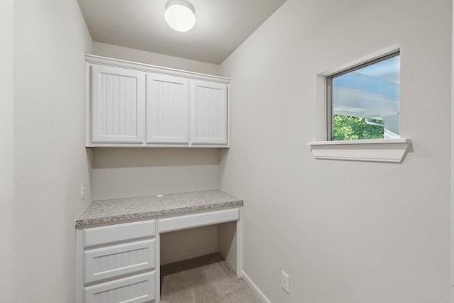 1309 Constitution Dr, Mckinney, TX 75071 - unfurnished office featuring built in desk, light colored carpet, and baseboards