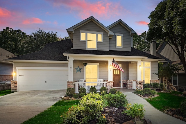 1309 Constitution Dr, Mckinney, TX 75071 - view of front of house with a porch, brick siding, concrete driveway, an attached garage, and a shingled roof