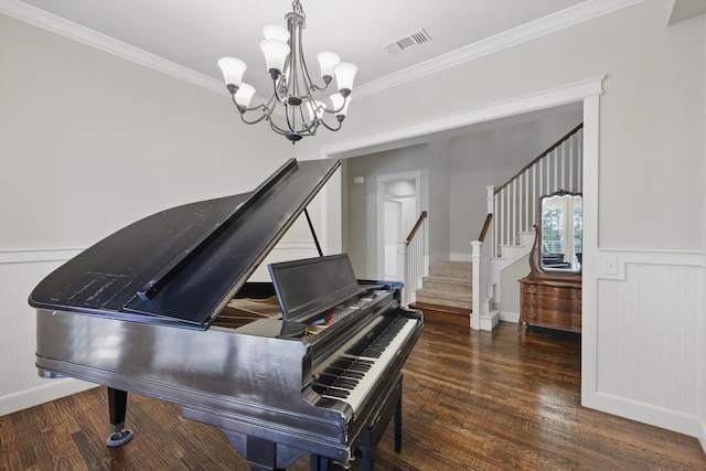 1309 Constitution Dr, Mckinney, TX 75071 - living area with a chandelier, wood finished floors, crown molding, stairs, and wainscoting