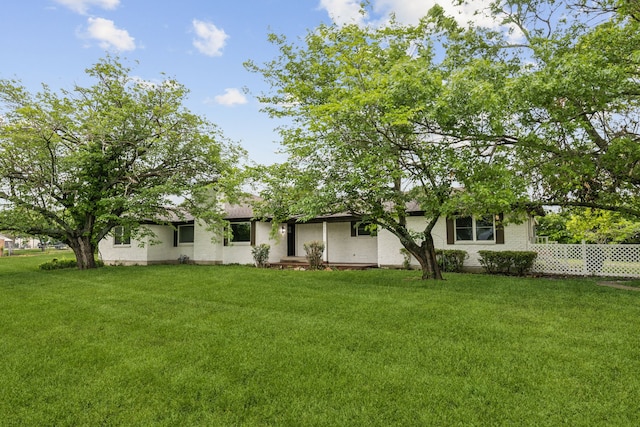 740 Davis Dr, Rockwall, TX 75087 - rear view of property with a yard