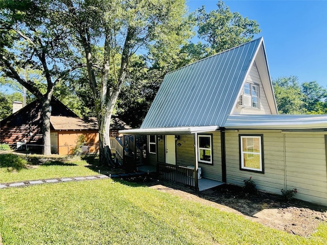 118 Ricky Rd, Gun Barrel City, TX 75156 - view of front of property featuring a porch, a front lawn, and metal roof
