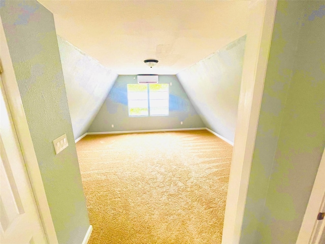 118 Ricky Rd, Gun Barrel City, TX 75156 - additional living space with carpet flooring, baseboards, lofted ceiling, and a wall mounted air conditioner