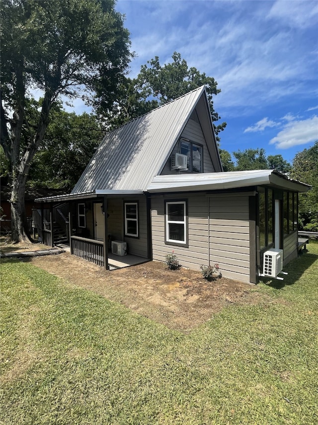 118 Ricky Rd, Gun Barrel City, TX 75156 - rear view of house with a lawn, ac unit, metal roof, and cooling unit
