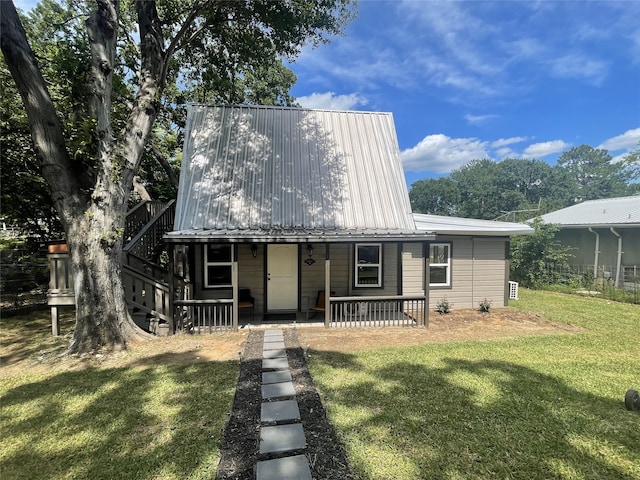 118 Ricky Rd, Gun Barrel City, TX 75156 - view of front of property featuring a front lawn, metal roof, and covered porch