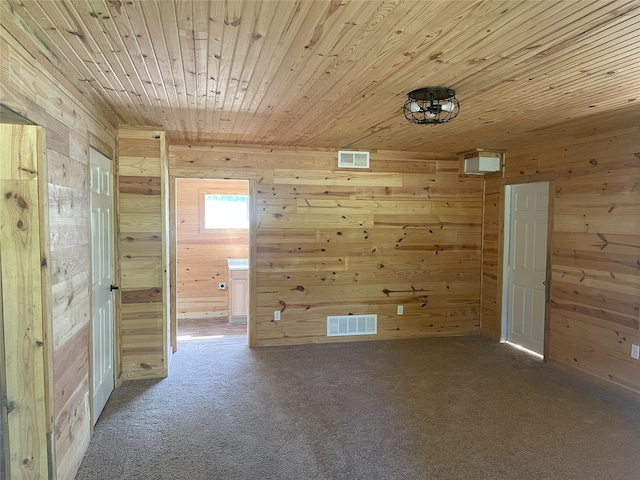 118 Ricky Rd, Gun Barrel City, TX 75156 - unfurnished room with wood walls, wooden ceiling, and carpet floors