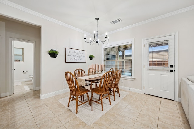 dining room featuring a chandelier, crown molding, light tile patterned flooring, and baseboards