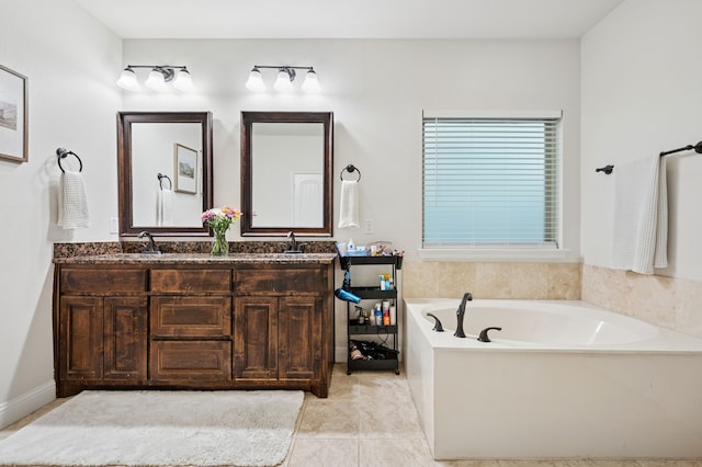bathroom with a garden tub, double vanity, and tile patterned flooring