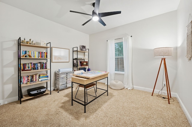 office space with carpet flooring, a ceiling fan, and baseboards