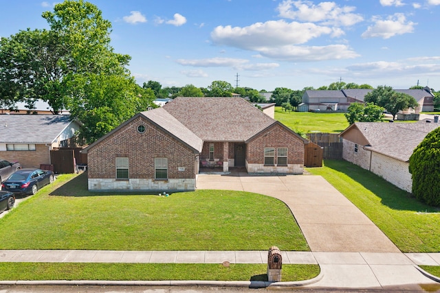 view of front of house featuring brick siding, a gate, roof with shingles, and concrete driveway